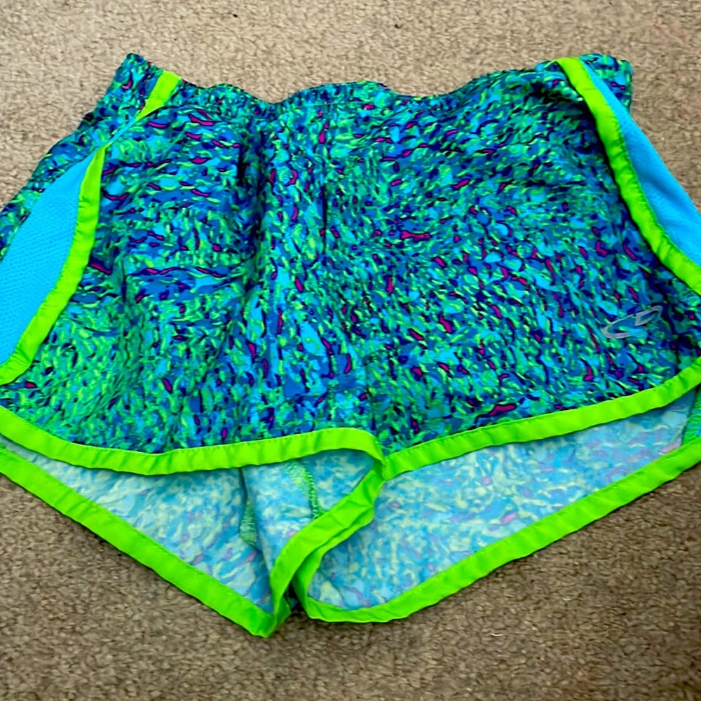 This pair of multi colored Champion shorts is in a size medium.